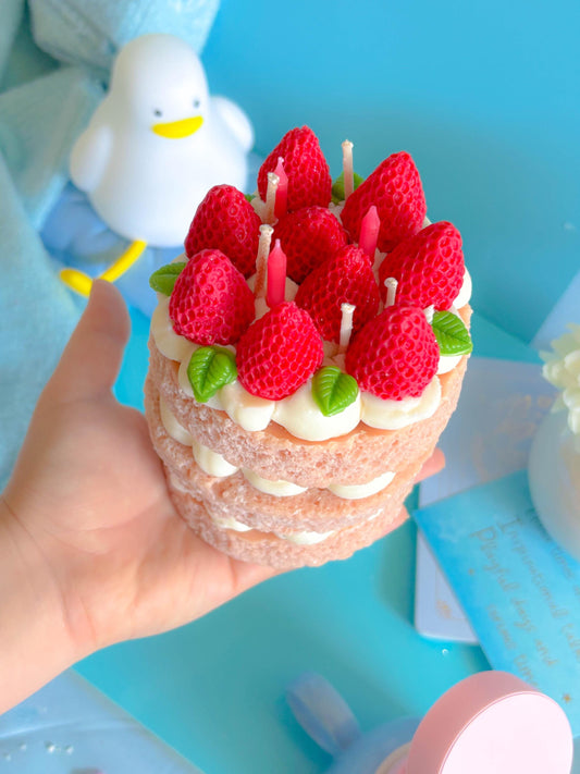 Cute three tier strawberry sponge cake candle